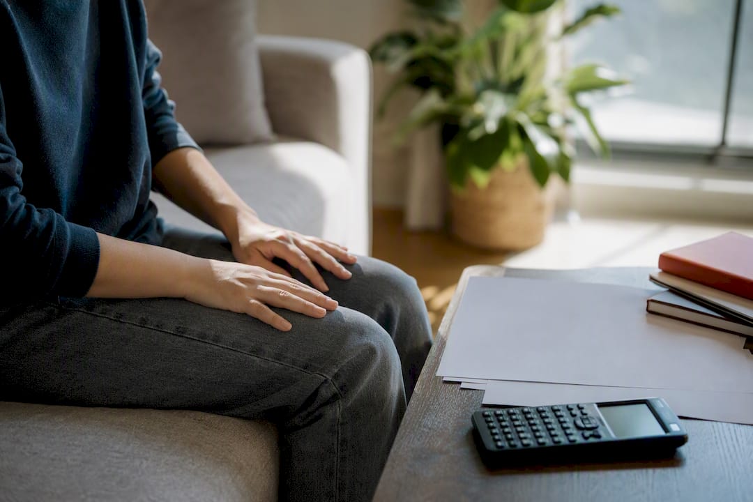 Hands resting away from study desk during break