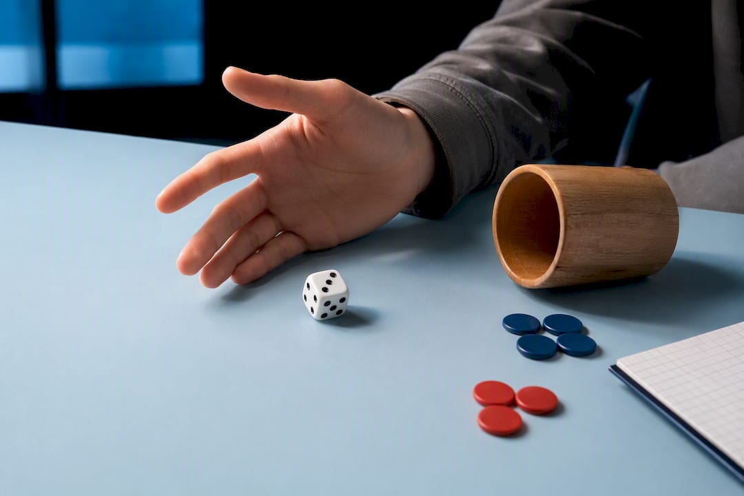 Die and counters used for probability practice
